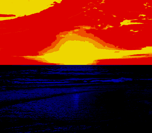 A saturated image of a Sunset. The reds, yellows, and oranges of the sky are so full blooded as to become block colours, mostly scarlet red. A change from one colour to another presents as a crack in the atmosphere. The sun could be an exposion. The horizon line is sharp and dead straight, and the sea is black, rippled with deep blues.